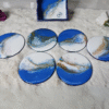 Handcrafted ocean-inspired resin coaster set with shimmering details