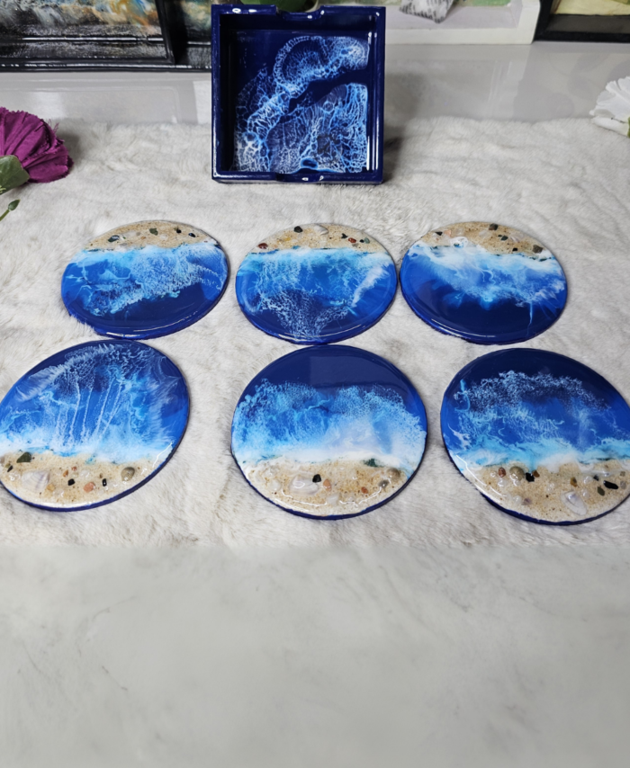 Unique beach-inspired wooden coasters with resin waves and sand
