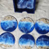Handmade wooden resin coasters with ocean wave design.