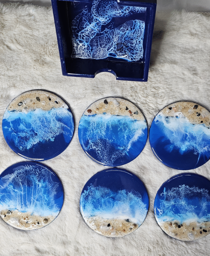 Handmade wooden resin coasters with ocean wave design.