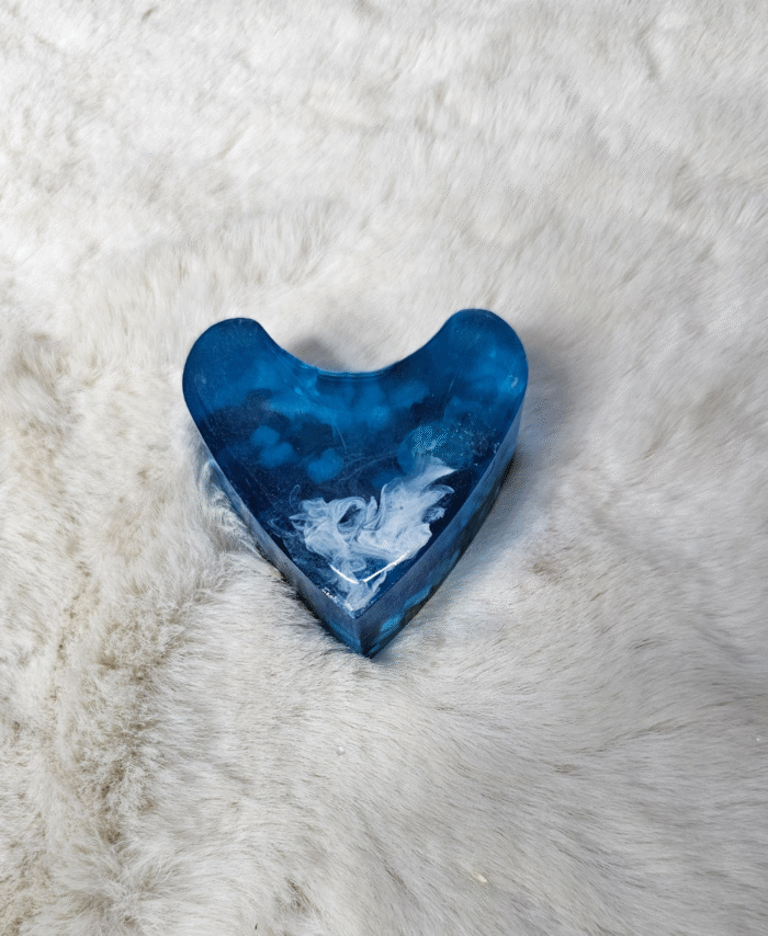 Blue resin heart paperweight with cloudy swirl effect