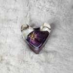 Transparent resin heart paperweight with cloudy swirl effect