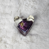 Transparent resin heart paperweight with cloudy swirl effect