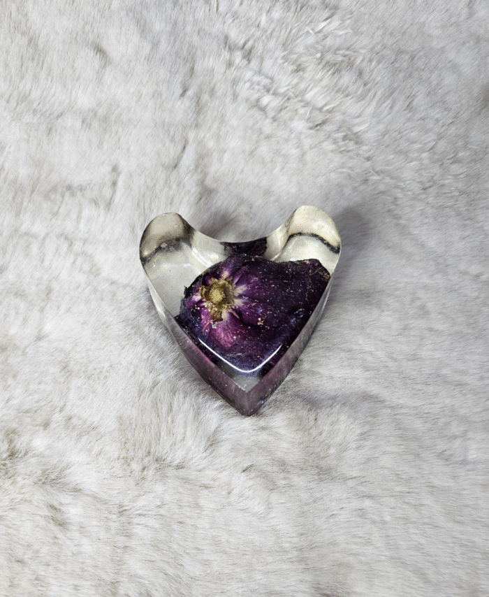 Transparent resin heart paperweight with cloudy swirl effect