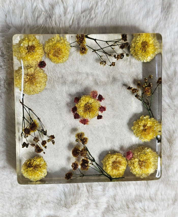 Square resin paper weight with dried yellow and pink flowers