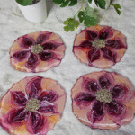 Handmade floral resin coasters with purple flower design