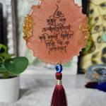 Gayatri mantra resin hanging with red tassel and evil eye charm