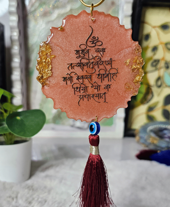 Gayatri mantra resin hanging with red tassel and evil eye charm