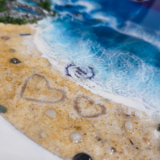 Ocean-inspired resin wall hanging with golden sand