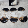 Blue and white resin coasters with ocean wave design and holder
