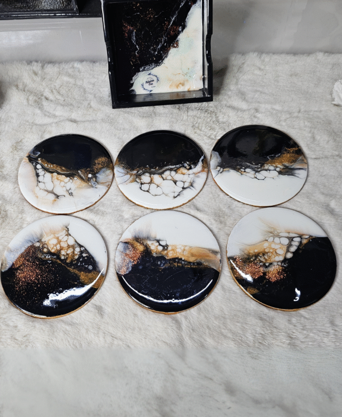 Blue and white resin coasters with ocean wave design and holder
