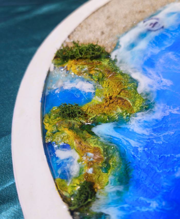 Ocean-inspired resin wall hanging with seashells