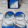 Galaxy-themed resin coasters with blue hues and glittering finish