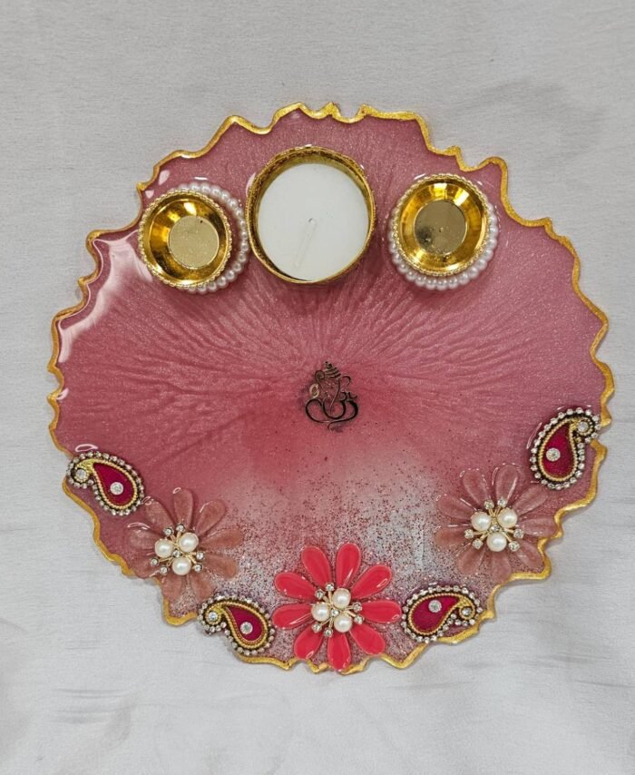 Handmade pink pooja thali with floral decorations