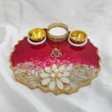 Resin pooja plate in dark red with pearl flower decoration