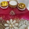 Elegant handmade red pooja thali for Diwali rituals