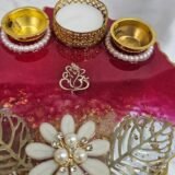 Elegant handmade red pooja thali for Diwali rituals