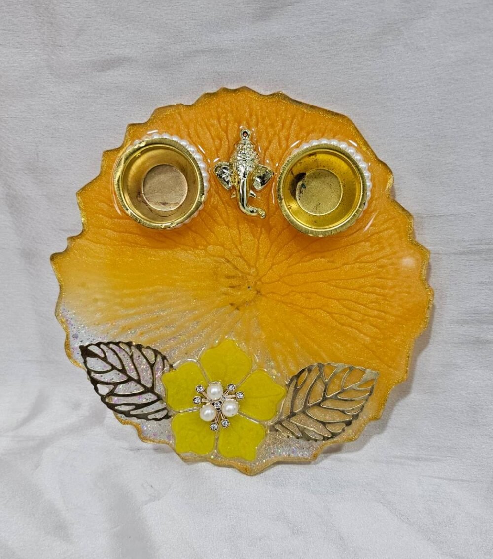 Handmade yellow pooja thali with Ganesha design and floral work