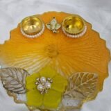 Handmade yellow pooja thali with Ganesha design and floral work