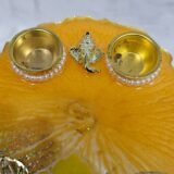 Elegant yellow thali for Diwali and Ganesh Chaturthi rituals