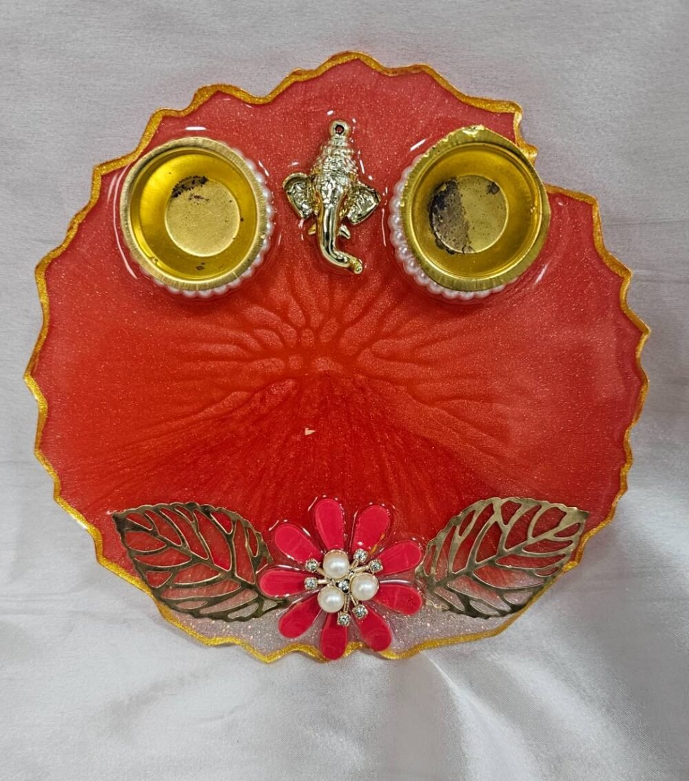 Red resin pooja thali with Ganesh idol and pearls