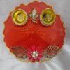 Red resin pooja thali with Ganesh idol and pearls