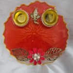 Red resin pooja thali with Ganesh idol and pearls