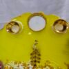 Elegant Ganesha Poja Thali with floral and pearl design.
