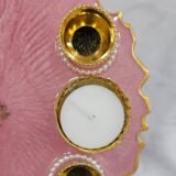 Decorative pink pooja thali with diya holders