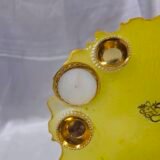 Customizable golden diya thali with floral accents.