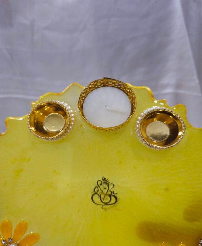 Traditional Golden Diya Plate with intricate floral designs.