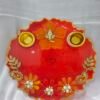 Pink Resin Diya Thali with peacock design and dual diya holders.