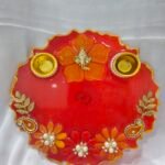 Pink Resin Diya Thali with peacock design and dual diya holders.