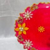 Handmade yellow diya plate for Diwali rituals.