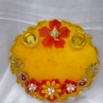 Blue Resin Diya Thali with floral design and pearl accents.