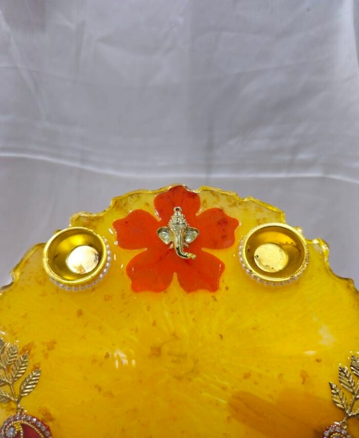 Handmade Diya Thali with vibrant blue hues and floral embellishments.
