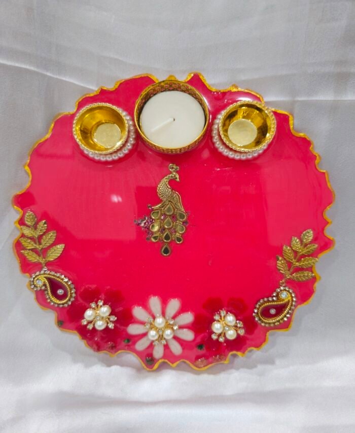 Pink pooja thali with golden peacock and pearl diya holders