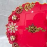 Elegant wedding pooja plate with peacock motif