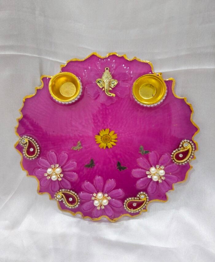 Pink decorative pooja thali with Ganesh idol and pearl work