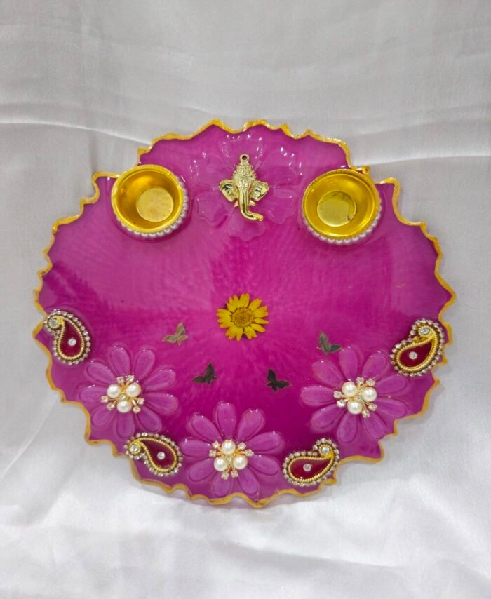 Pink decorative pooja thali with Ganesh idol and pearl work
