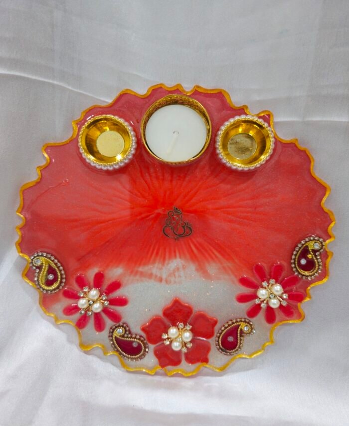 Red resin art pooja thali with pearl flowers and diya holders
