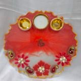 Red resin art pooja thali with pearl flowers and diya holders
