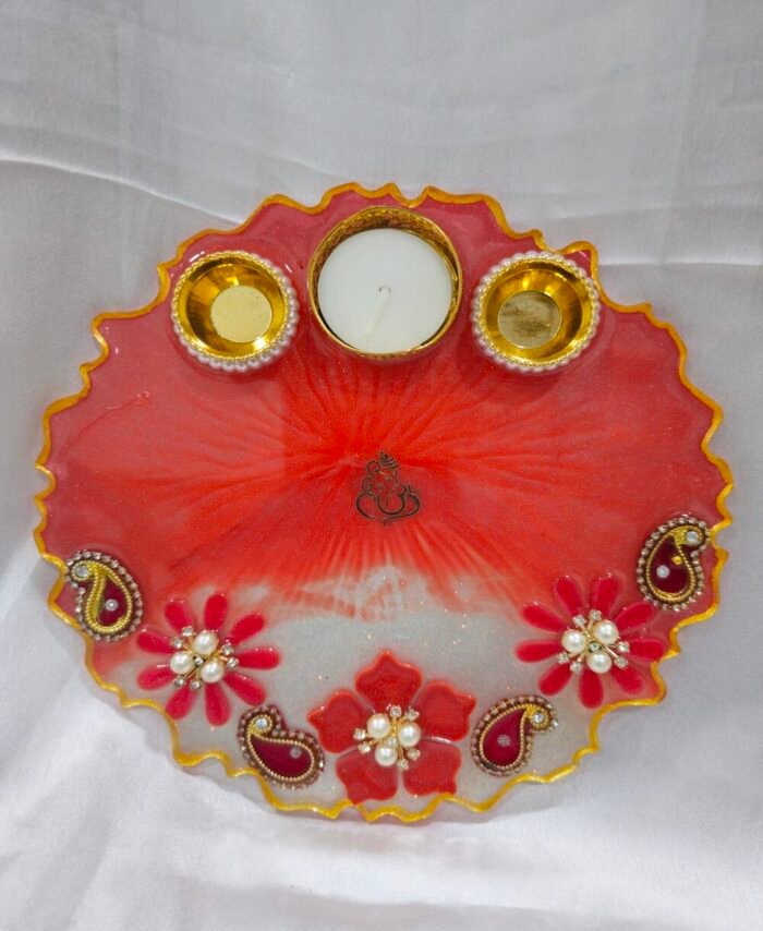 Red resin art pooja thali with pearl flowers and diya holders