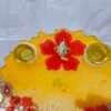 Traditional Diwali Thali with golden peacock and floral embellishments.