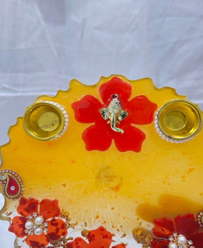 Traditional Diwali Thali with golden peacock and floral embellishments.