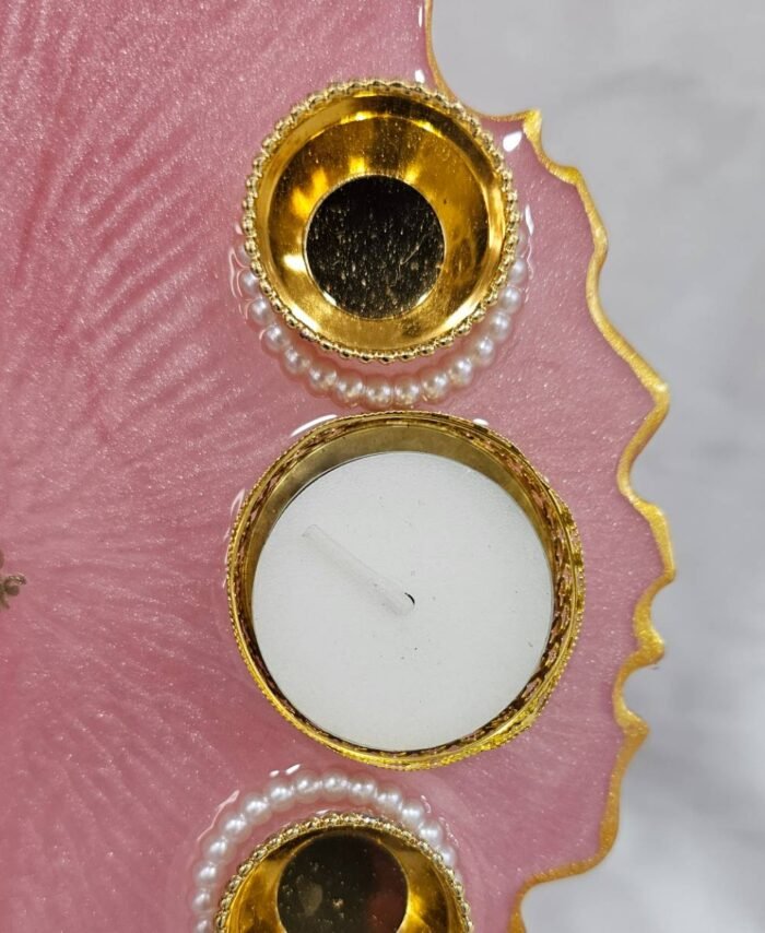 Decorative pink pooja thali with diya holders