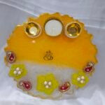 Yellow Diya Thali with Floral and Pearl Decorations.