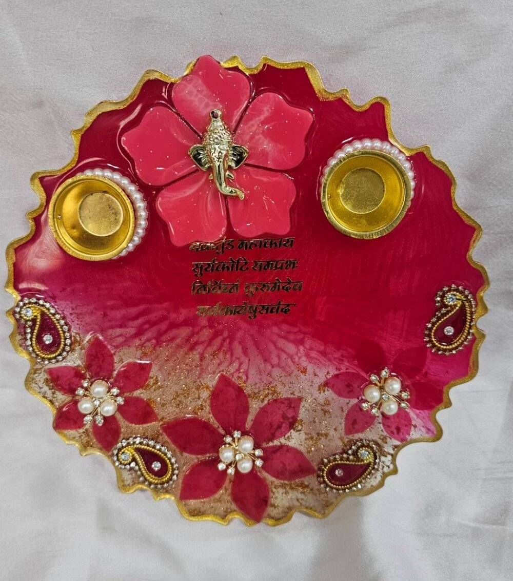 Peach resin pooja thali with paisley and floral design