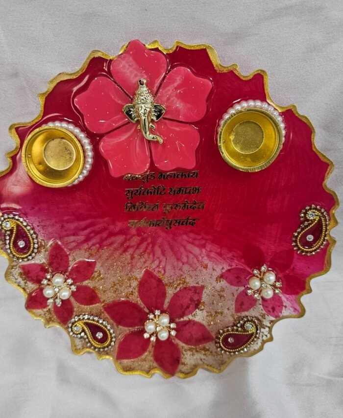 Peach resin pooja thali with paisley and floral design