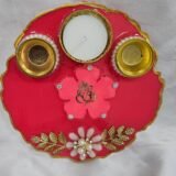 Maroon resin pooja thali with Ganesh idol and shloka